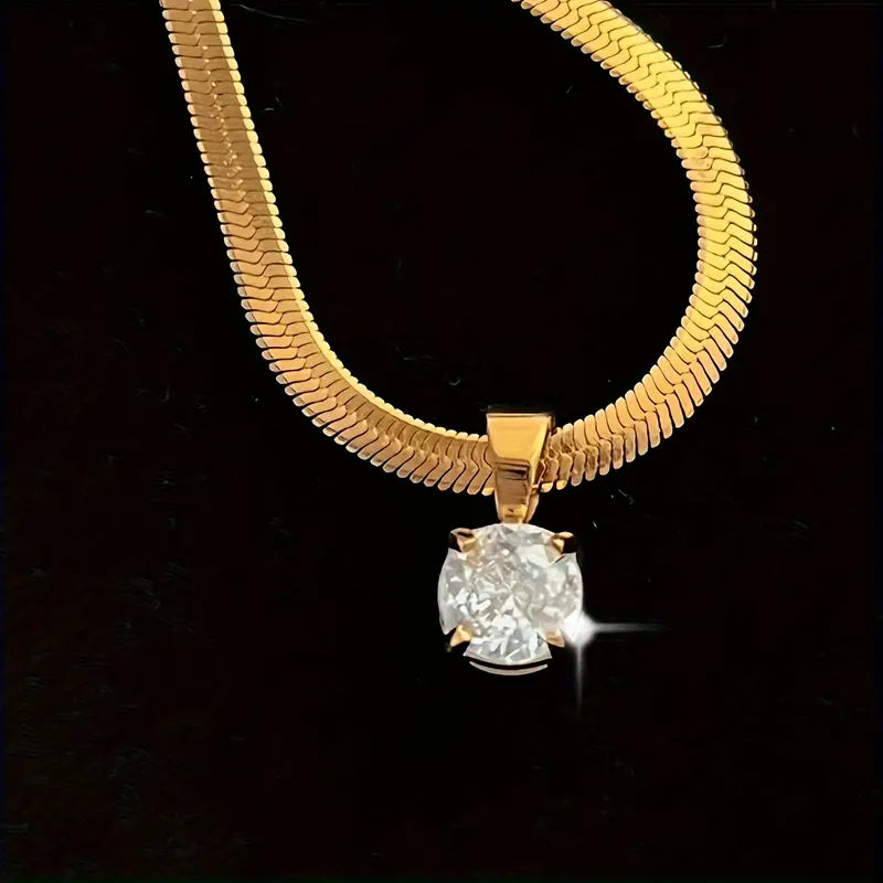 Elegancki złoty wisiorek z kryształem