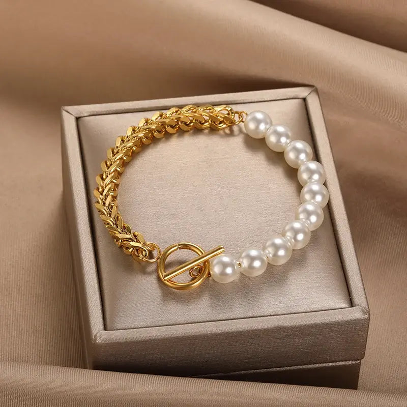 Elegancka złota bransoletka z perłami